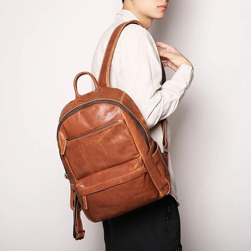 Trendha Men's Leather 14-inch Computer Backpack in Black and Retro Brown colours, featuring a spacious main compartment, laptop sleeve, and multiple pockets for organised storage.