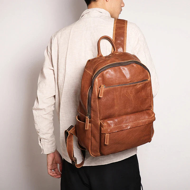 Trendha Men's Leather 14-inch Computer Backpack in Black and Retro Brown colours, featuring a spacious main compartment, laptop sleeve, and multiple pockets for organised storage.