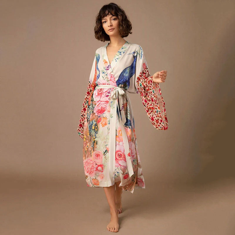 Elegant peacock-printed beach cover-up with lightweight, breathable fabric for stylish sun protection