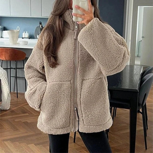 Classic padded fleece jacket in various colours for women, featuring a zip-up design and pockets