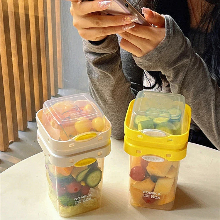 Dual-layer meal prep container with separate compartments and leak-proof lid, available in yellow and cream white colors