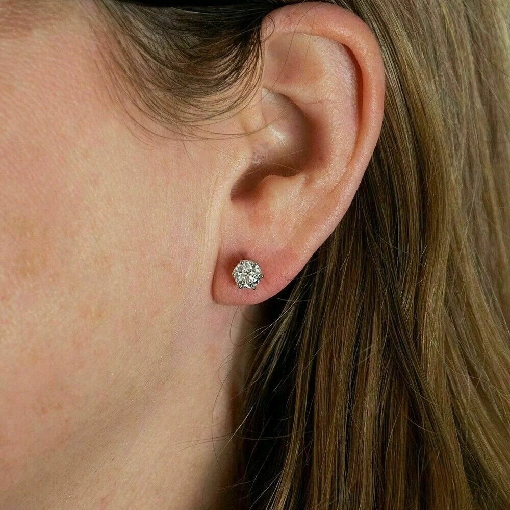 Elegant six-claw diamond zircon ear studs in white gold-toned finish, a fusion of traditional and contemporary style
