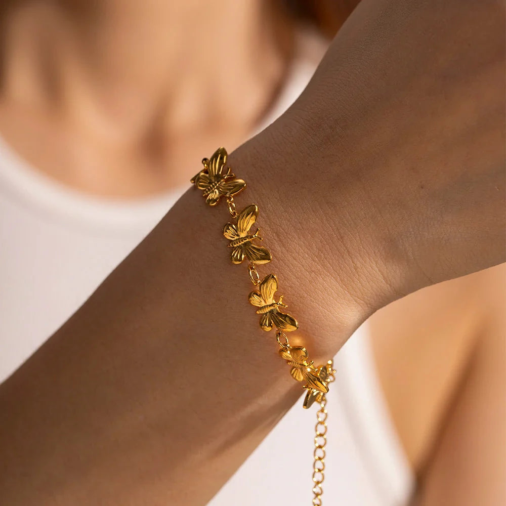 Elegant stainless steel butterfly bracelet with delicate design, available in various colours for UK women's fashion accessories