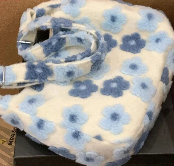Large capacity fur bag with floral elements and adjustable straps