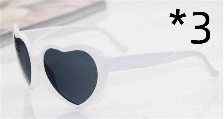 Stylish heart-shaped sunglasses with unique lens design that transforms light into enchanting special effects