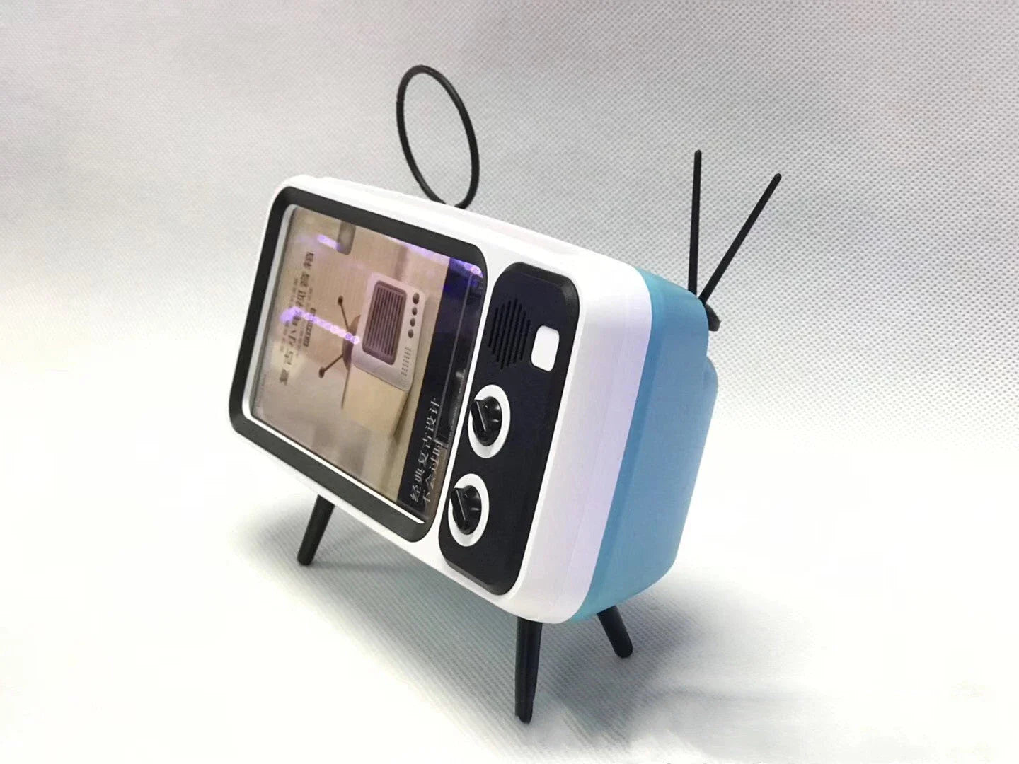 Vintage-inspired portable Bluetooth speaker with retro TV-style design and sleek, compact body