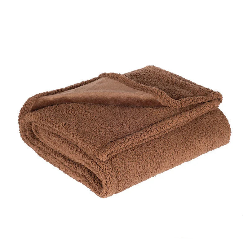 Plush Sherpa Pet Blanket in various colors and sizes, designed for comfort and warmth for your furry friend