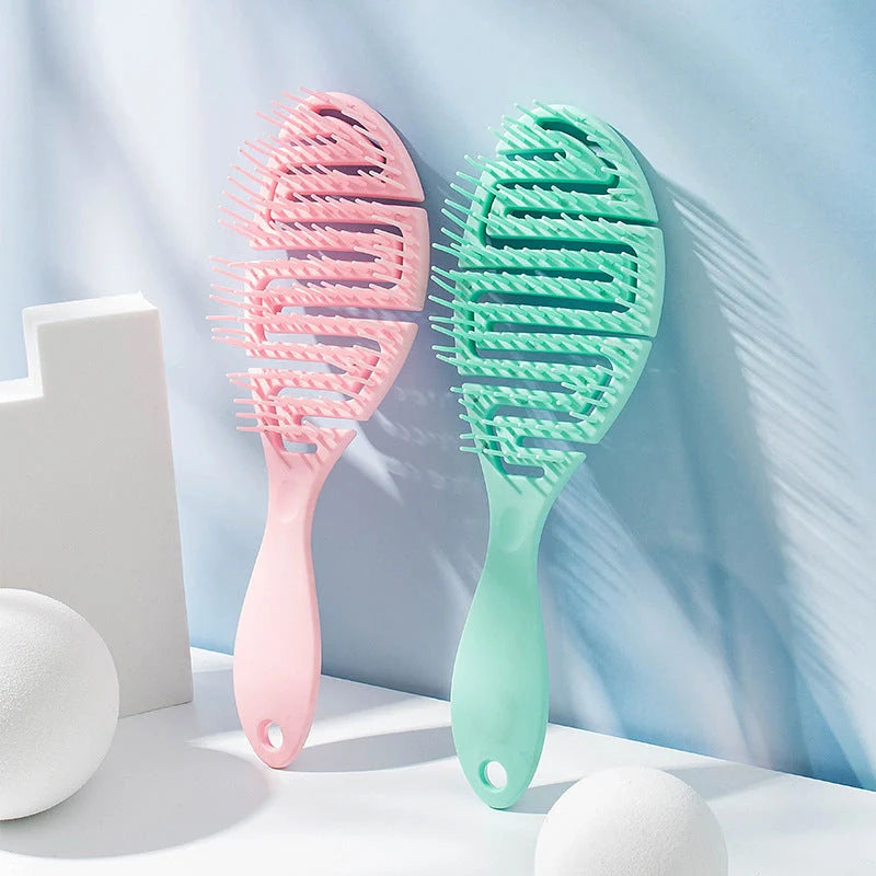 Stylish Massage Comb in various colours offering a soothing scalp massage and modern, minimalist design