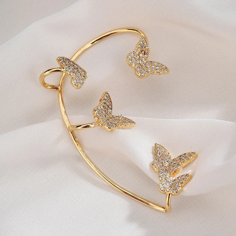 Sparkling butterfly-shaped ear cuffs with zirconia stones, available in gold and silver alloy finishes