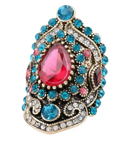 Elegant bohemian-style jewellery set featuring necklaces, earrings, and rings in a variety of colours and sizes
