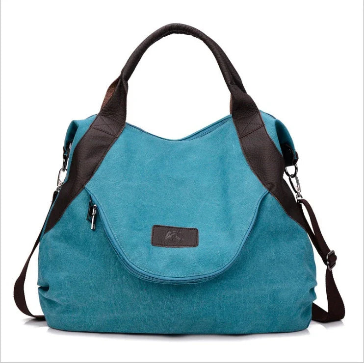 Stylish and versatile canvas shoulder bag with premium brass hardware and thoughtful interior organisation