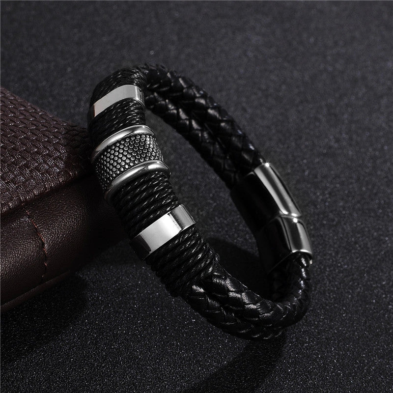 Premium black braided leather bracelet with titanium and stainless steel clasp, a timeless accessory for the modern gentleman