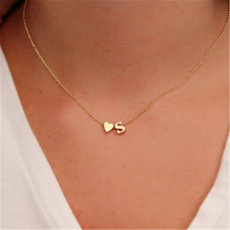 Heart-shaped pendant necklace with adjustable chain in various metallic finishes