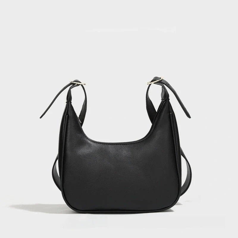Stylish women's PU leather dumpling crossbody bag in black and white