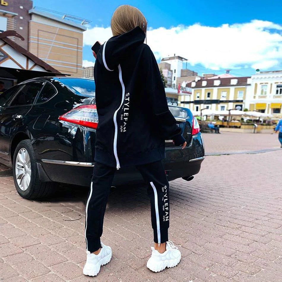 A stylish long hoodie jumpsuit in a variety of sophisticated colours, featuring a flattering silhouette and premium materials for all-day comfort.