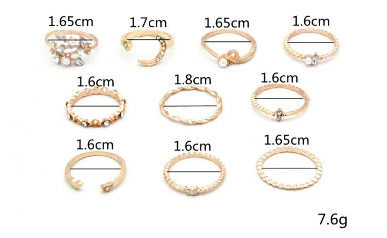 A set of 10 adjustable gold-plated rings with celestial-inspired designs including moons, stars, and pearls