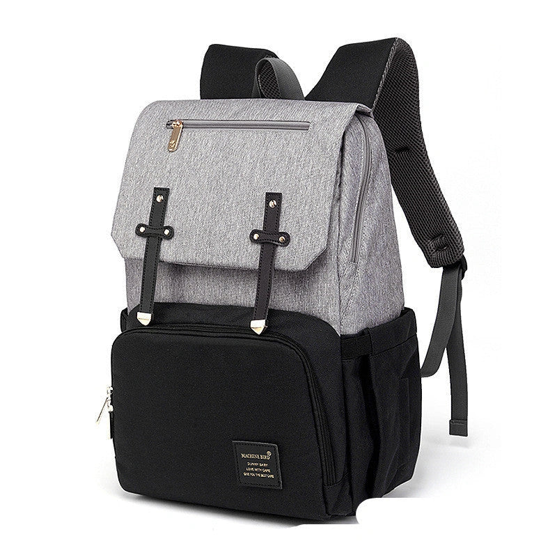 Versatile mummy bag with stroller hooks, side pockets, and zippered compartments for storing baby essentials