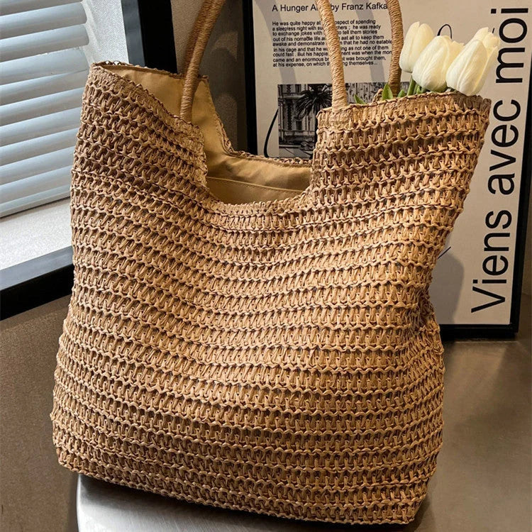 A stylish and spacious straw tote bag in brown and beige colours, perfect for British women on the go.