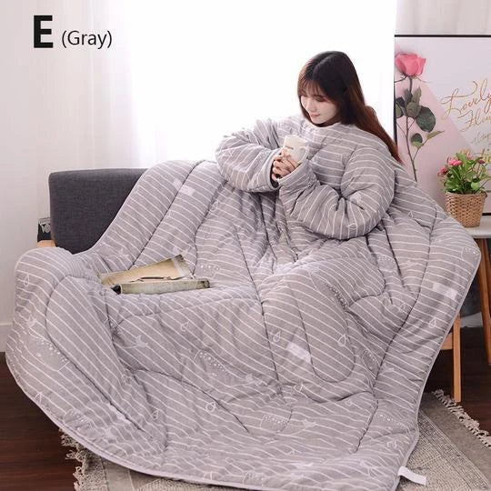 Cozy quilted lounger with sleeves in various colors and sizes, perfect for year-round indoor comfort and relaxation.