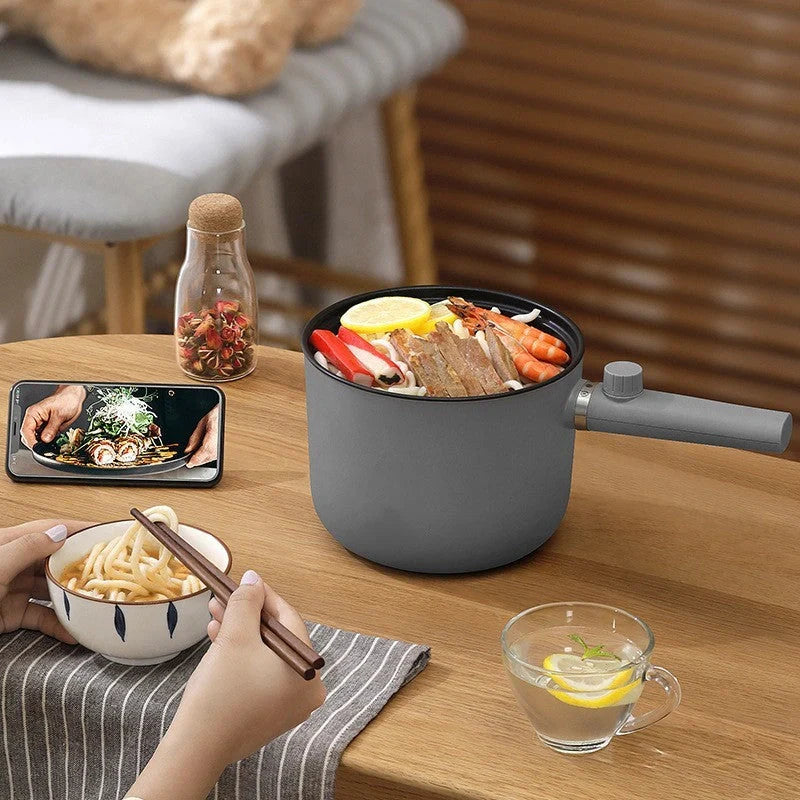 Mini Electric Fondue Pan with ceramic glaze interior and compact design