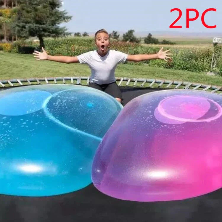 Oversized inflatable bounce balls in various vibrant colors for fun parties and celebrations