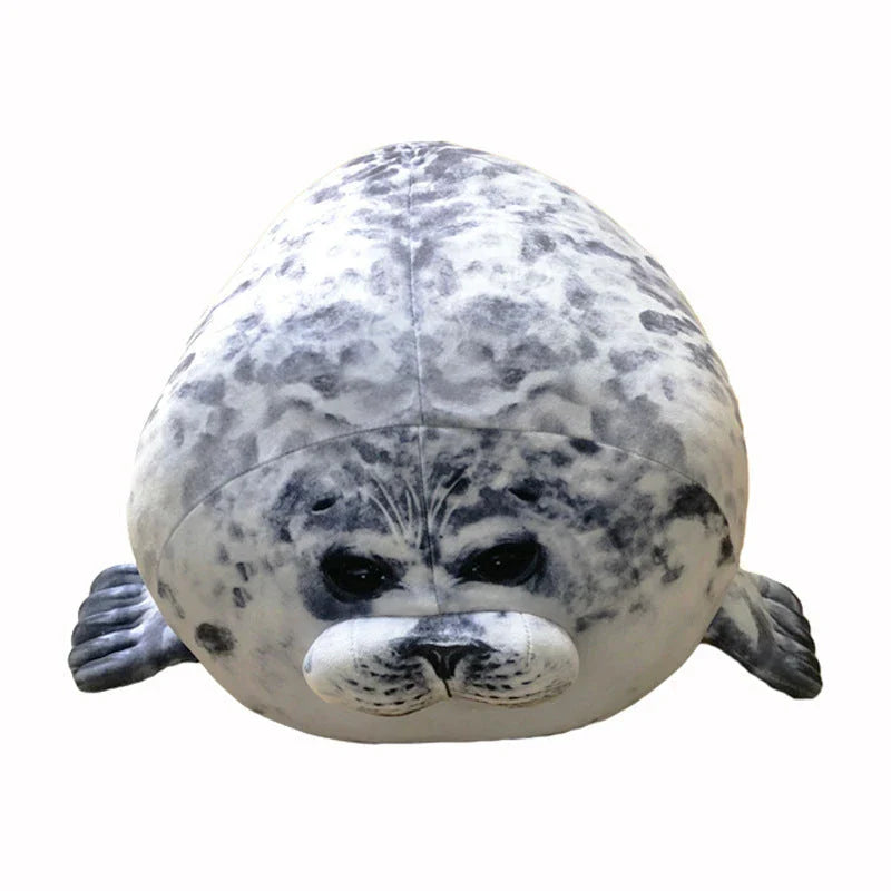 A plush, soft, and cuddly grey or white seal-shaped cushion with a detailed, lifelike design