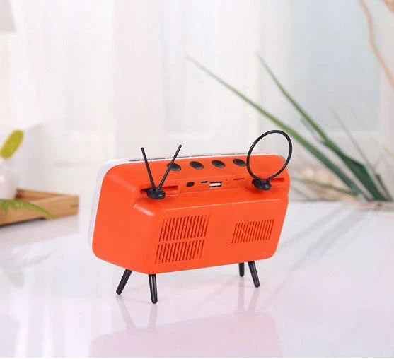 Vintage-inspired portable Bluetooth speaker with retro TV-style design and sleek, compact body