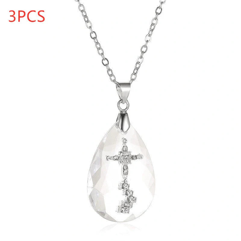 Elegant white drop pendant necklace with cross-chain design, made of premium electroplated alloy for a timeless and sophisticated look.