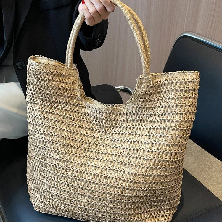 A stylish and spacious straw tote bag in brown and beige colours, perfect for British women on the go.