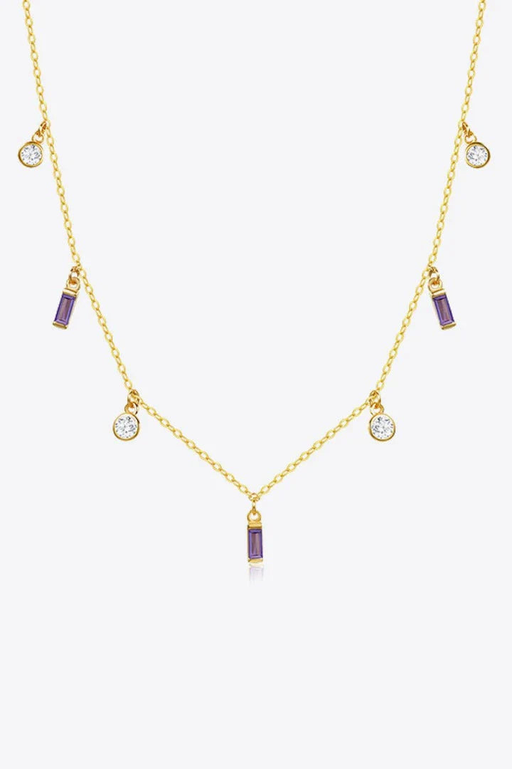 Elegant 18K gold-plated multi-charm chain necklace with delicate charms and a minimalist design