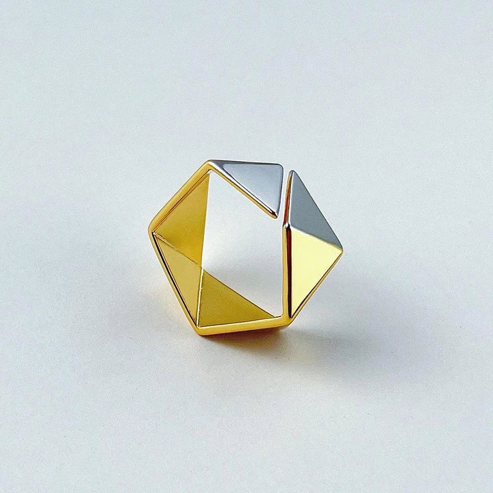 Close-up of a 18K gold-plated ring featuring a genuine meteorite insert with mesmerising natural patterns