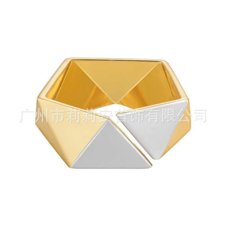 Close-up of a 18K gold-plated ring featuring a genuine meteorite insert with mesmerising natural patterns