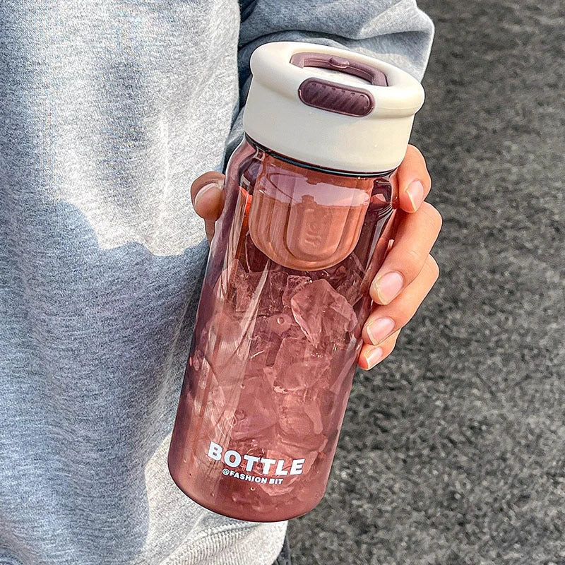 Minimalist modern sports water bottle with tea infuser compartment, in pink colour