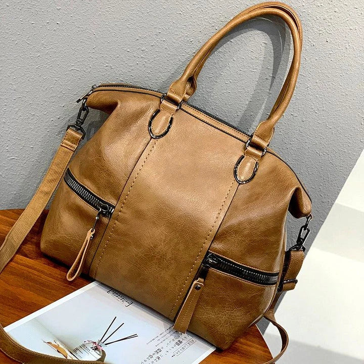 A stylish and spacious leather shoulder messenger bag in a variety of colours, featuring high-quality British craftsmanship