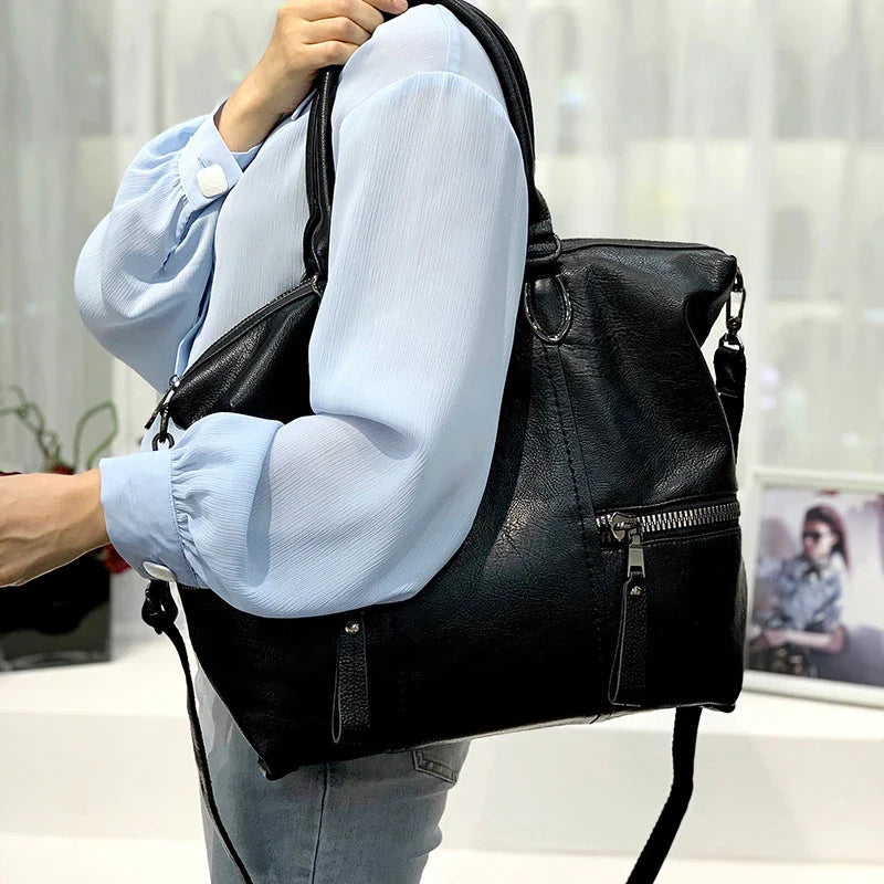 A stylish and spacious leather shoulder messenger bag in a variety of colours, featuring high-quality British craftsmanship