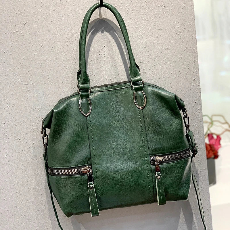 A stylish and spacious leather shoulder messenger bag in a variety of colours, featuring high-quality British craftsmanship
