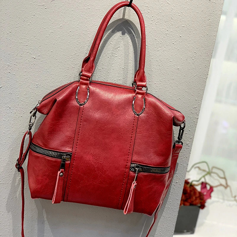 A stylish and spacious leather shoulder messenger bag in a variety of colours, featuring high-quality British craftsmanship
