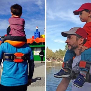 A parent carrying their child hands-free using the Hands-Free Shoulder Carrier, a versatile and comfortable child-carrying accessory.