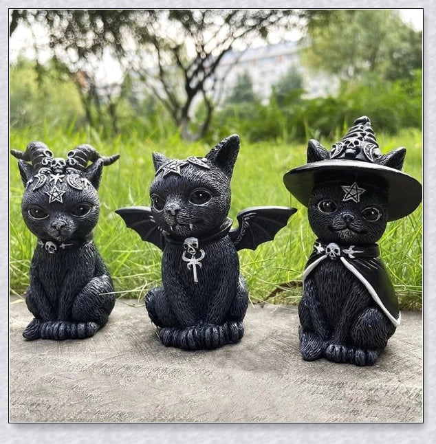 Cute and spooky black cat Halloween decorations with horns, wings, and witch hats