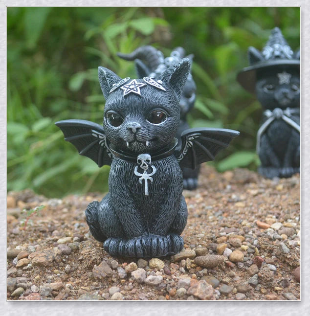 Cute and spooky black cat Halloween decorations with horns, wings, and witch hats