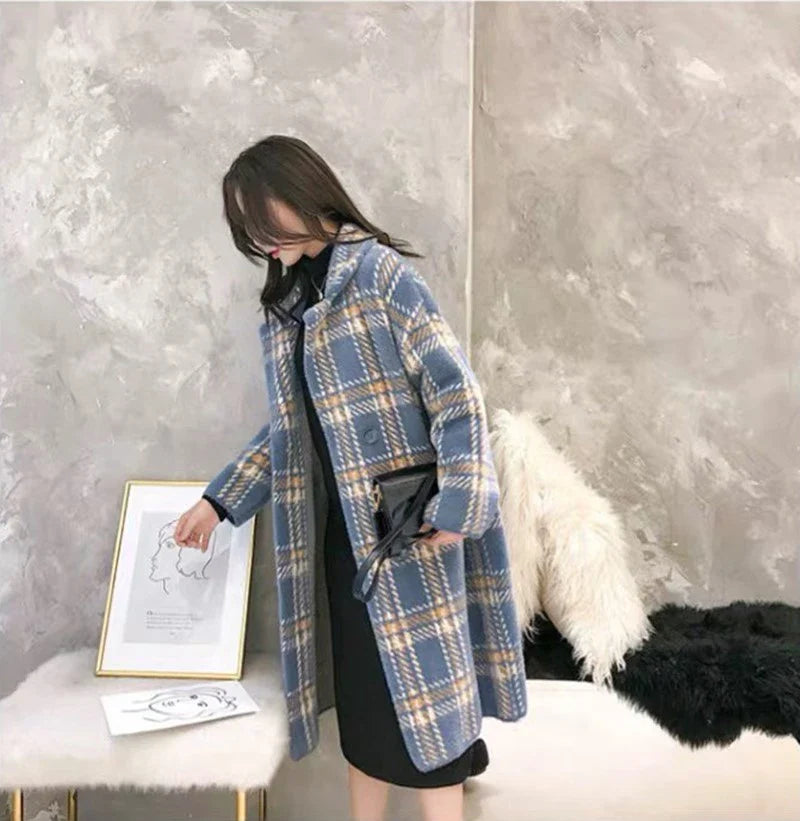 A cosy, thick knitted sweater coat in a classic plaid pattern, featuring a luxurious mink hair blend for superior softness and warmth.