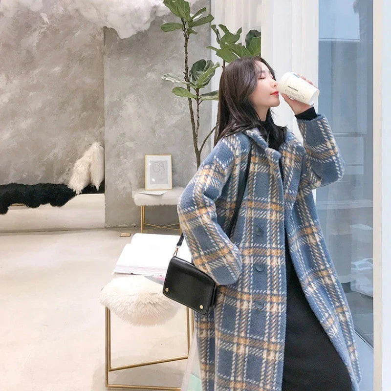 A cosy, thick knitted sweater coat in a classic plaid pattern, featuring a luxurious mink hair blend for superior softness and warmth.