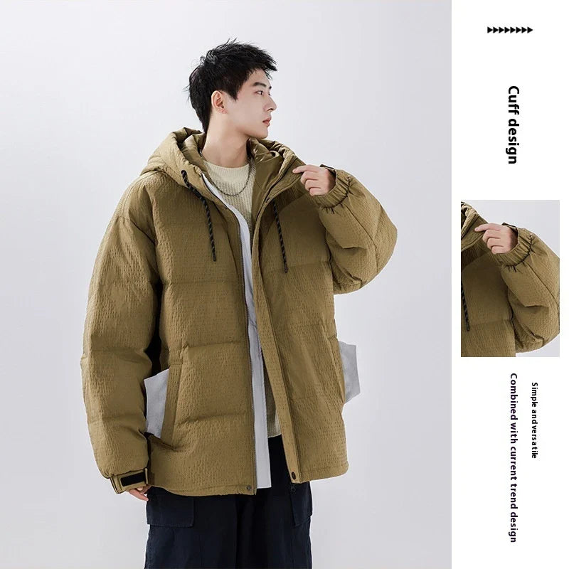 A cosy, black 90% white duck down jacket with a streamlined, modern design, perfect for navigating the ever-changing British weather.