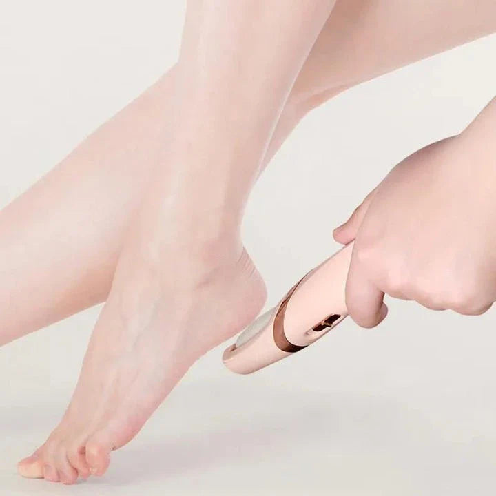 Portable, rechargeable electric foot file in grey, designed to remove dead skin and calluses for soft, smooth feet