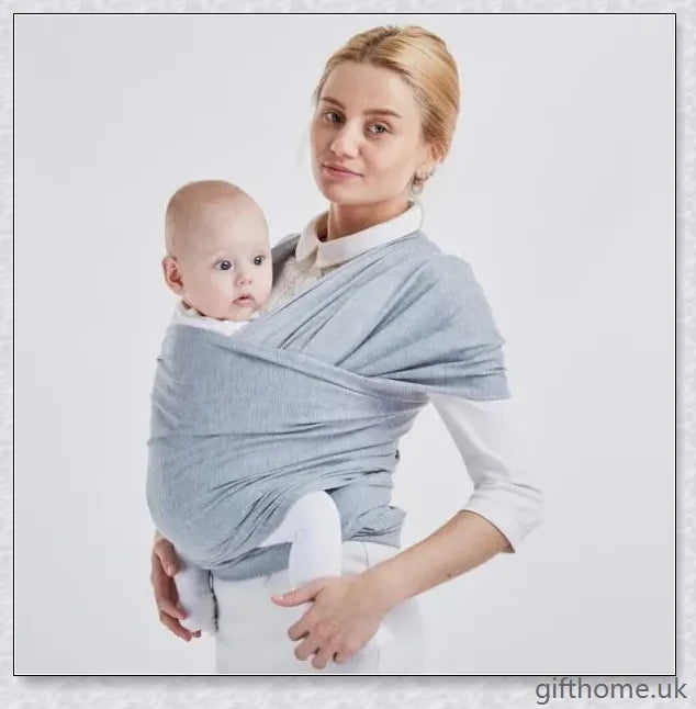 A cosy and comfortable baby carrier sling in a stylish design, perfect for hands-free parenting during family adventures