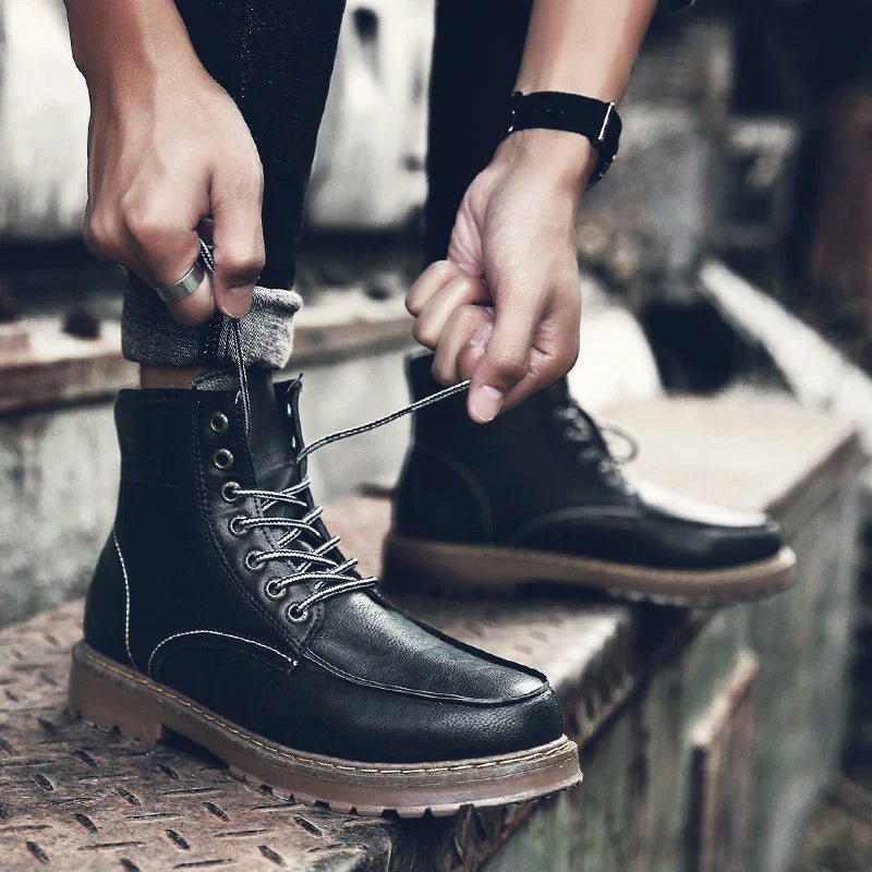 A pair of stylish and comfortable Martin boots for men, featuring a sleek PU upper and a durable rubber sole for everyday casual wear.