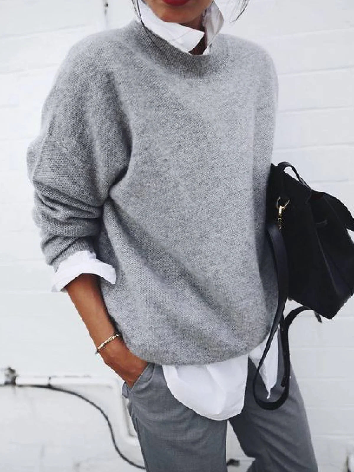 A long sleeve knitted jumper in various solid colours, including light gray, black, khaki, blue, and pink