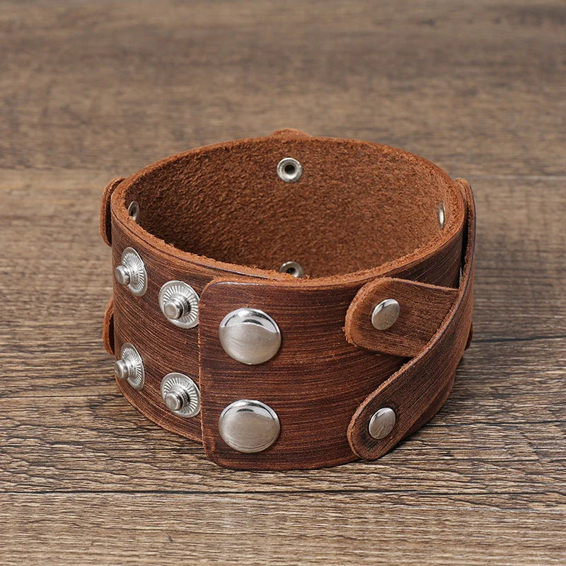 Vintage-inspired brown leather bracelet with geometric shapes and multi-layered design