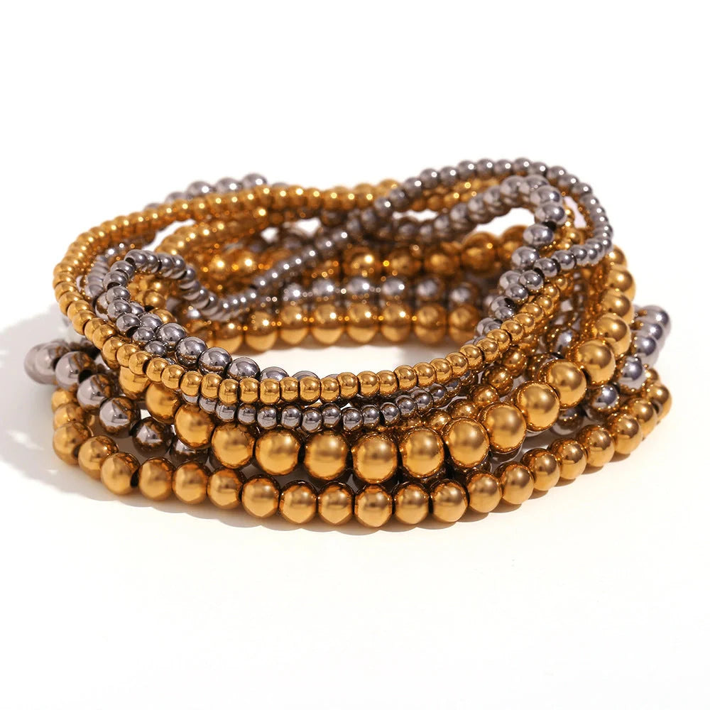 Vintage-inspired stainless steel and 18K plated elastic bead bracelet in a range of sizes and colours