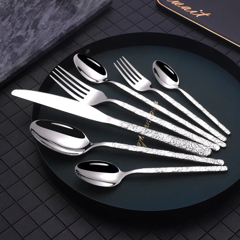Premium steak cutlery set with embossed textured handles, made of durable stainless steel for a refined dining experience.